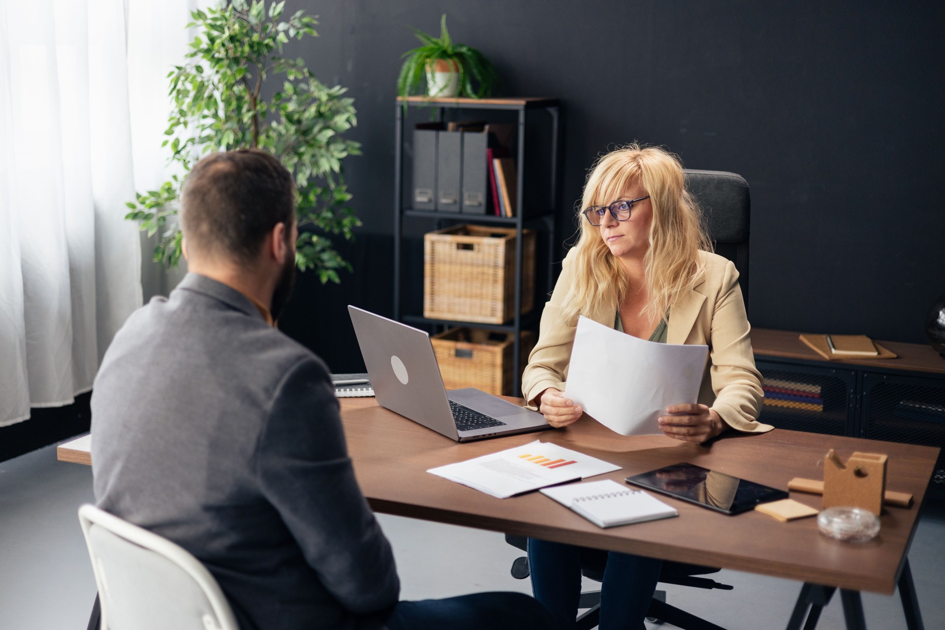 Manager interviewing male candidate during a business meeting